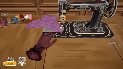 Close-up of the vintage sewing machine in Dressmaker with fabric being fed under the needle