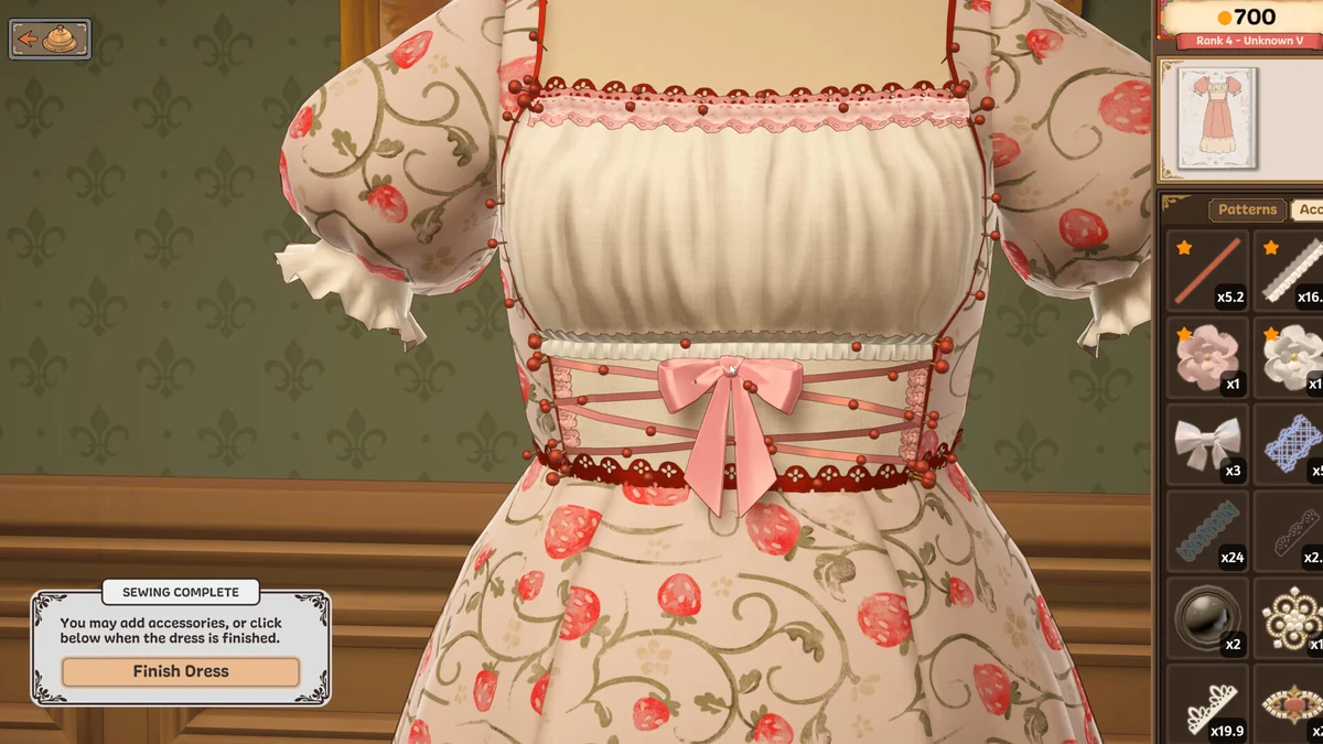 A finished cream and pink floral dress shown on the mannequin with construction scoring