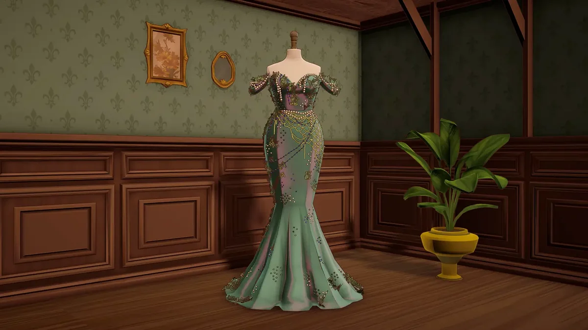 A finished green mermaid gown displayed on a dress form in the Dressmaker shop